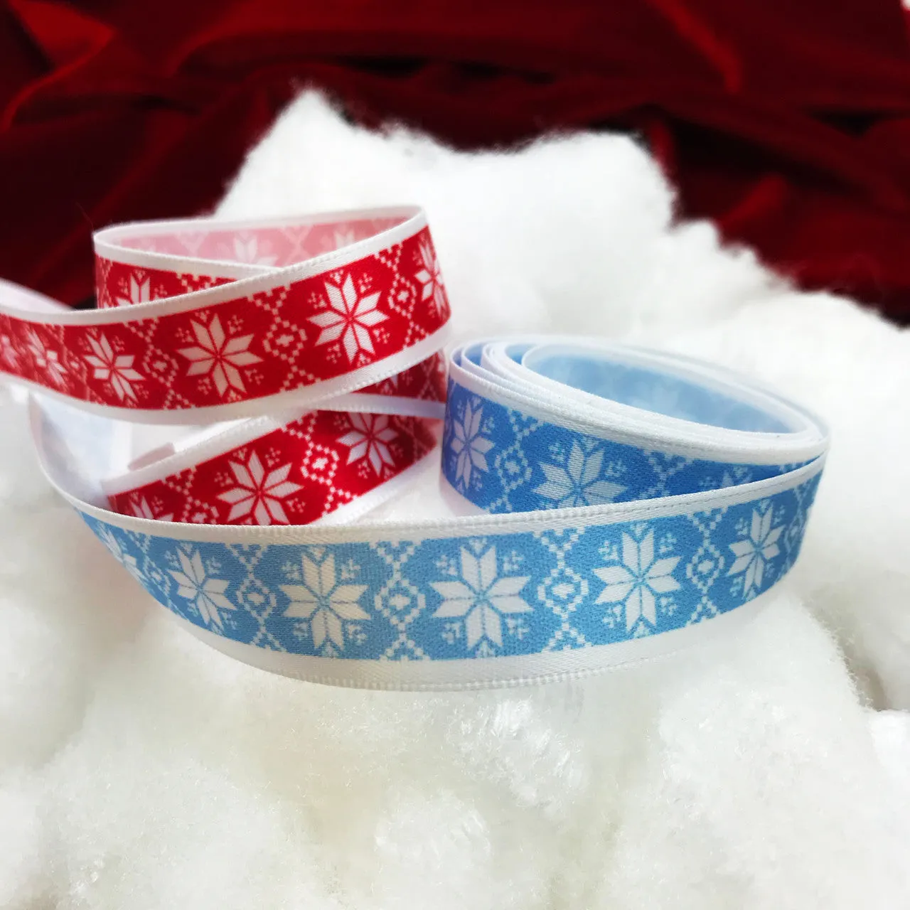 Nordic Design snowflake ribbon on an ice blue background printed on 5/8" white single face satin